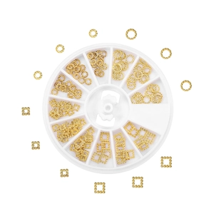 Macro detail of 12-grid rotary box with golden geometric nail art metal slices