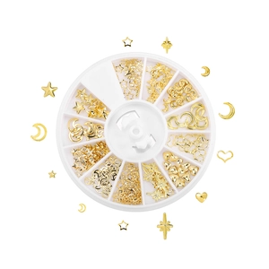 Detailed view of 12-slot storage box with various gold nail art alloy metal charms
