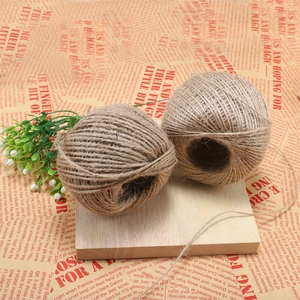 Detail of two rolls of natural 1-2mm jute twine for DIY crafts and garden decoration