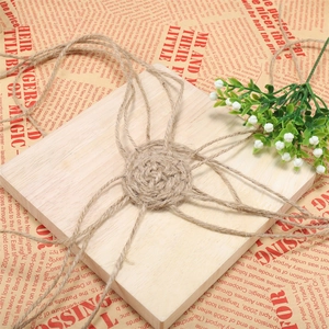 Natural 1-2mm jute twine cord wrapped on wooden board for DIY crafts and gardening