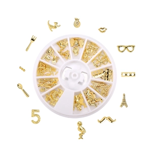 Golden DIY metal nail art charms and resin filler kit in a 12-slot circular organizer box