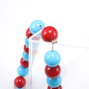 DIY 1-2mm hemp rope with red and blue beads on a minimalist acrylic stand display