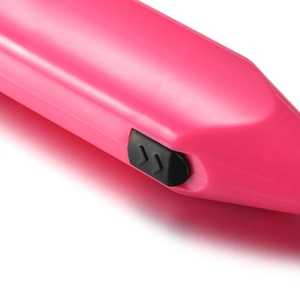 Detail of pink electric resin mixer featuring a black sliding power switch mechanism