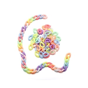 Macro shot of colorful acrylic chain links in macaron candy tones for DIY jewelry making