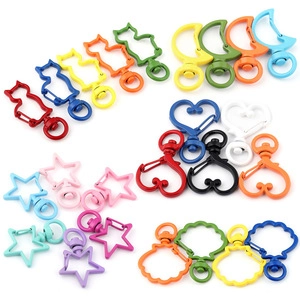 Colorful assorted metal lobster clasps in heart, star, and cat shapes for DIY jewelry