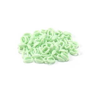 Close-up of light green oval acrylic chain links for DIY jewelry and accessories