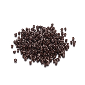 Macro view of 2mm dark brown cylindrical glass seed beads for DIY jewelry making