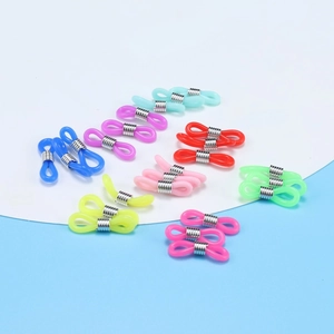 Close-up of colorful rubber eyeglass chain connectors with adjustable silver metal coils