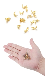 Macro detail of gold and silver stainless steel end crimp beads for DIY jewelry making