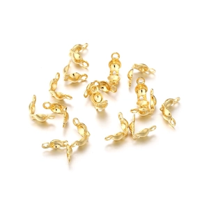 Macro view of gold-plated stainless steel calotte ends for jewelry necklace making