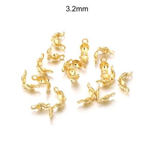 Detailed view of 3.2mm gold stainless steel clamshell bead tips for DIY jewelry making