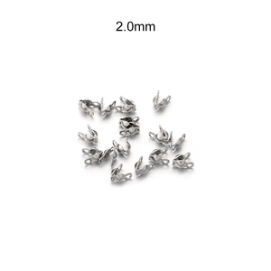 Macro detail of 2.0mm stainless steel bead tips and clamshell knots for DIY jewelry making