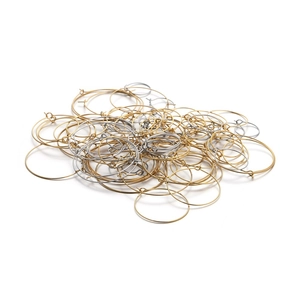 Close-up of bulk gold and silver stainless steel round hoop earring jewelry DIY parts