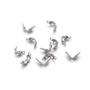 Macro detail of stainless steel clam shell bead tips for professional jewelry making