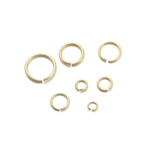 Macro shot of various sizes of 18K gold plated jump rings for DIY jewelry making