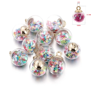 Detailed view of 16mm glass globe pendants with colorful star sequins and gold caps
