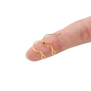 Macro view of gold-plated 925 silver earring hooks with S925 hallmark and spring detail