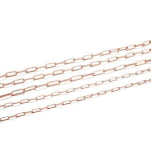 Close-up of rose gold paperclip chains in various sizes for DIY jewelry making