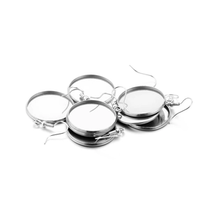 Macro view of silver stainless steel earring cabochon settings for DIY jewelry making