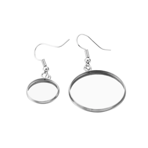 Macro shot of silver stainless steel French ear wire hooks and tray settings for DIY jewelry
