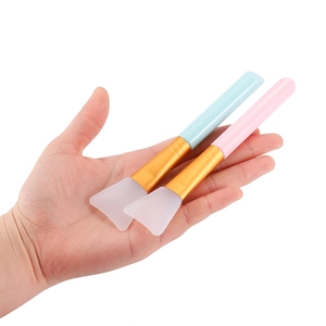 Silicone face mask brush set with soft flat heads in pink and blue for easy facial application
