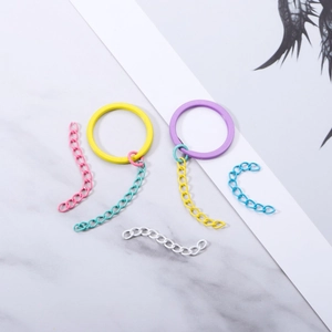Macro detail of colorful matte lacquered metal extension chains and rings for DIY crafts
