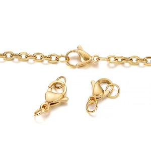 Macro detail of high-polish gold lobster clasps and O-chains for DIY jewelry making