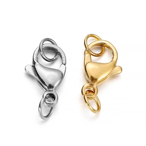 Close-up of gold and silver stainless steel lobster clasps with jump rings for DIY jewelry