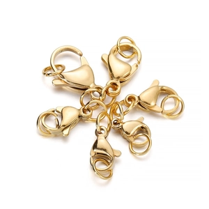 Close-up of gold stainless steel lobster clasps and jump rings for DIY jewelry making