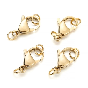 Detail of four gold lobster clasps with jump rings for jewelry making and DIY crafts