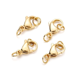 Close-up of golden stainless steel lobster clasps and open jump rings for DIY jewelry