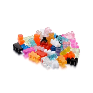 Assorted colorful resin gummy bear charms with transparent and matte finishes for DIY crafts