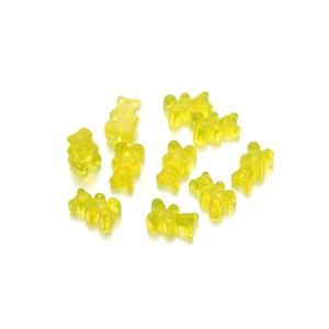 Close-up of ten yellow translucent resin bear charms with a smooth reflective finish