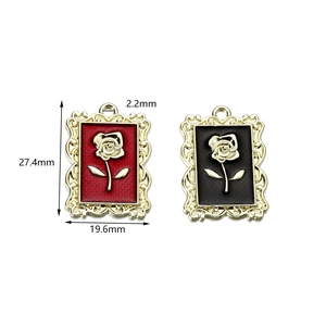 Close-up of vintage rose charms with dimensions 27.4mm by 19.6mm for DIY jewelry