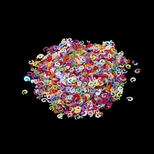 Close-up of colorful spiral glitter sequins for DIY jewelry and nail art crafts