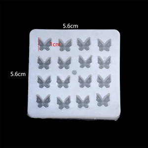 Detailed view of 16-cavity butterfly silicone mold with 5.6cm square dimensions