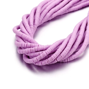 Close-up of 6mm purple clay heishi beads for DIY bohemian jewelry making