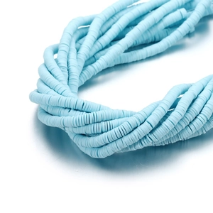 Close-up of 6mm sky blue heishi beads polymer clay discs for DIY jewelry making