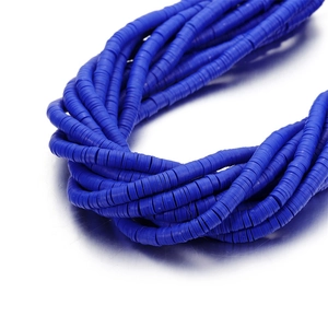 Macro detail of royal blue 6mm polymer clay heishi beads for DIY jewelry making