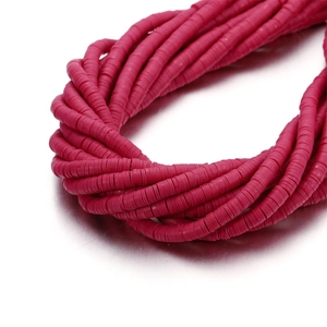 Macro detail of 6mm rose red flat heishi clay beads strands for DIY jewelry making