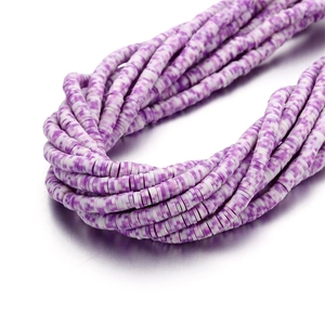 Macro detail of 6mm purple and white DIY Heishi beads for handmade jewelry making
