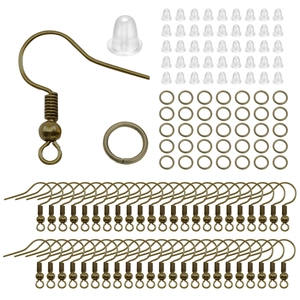 Close-up of antique bronze earring hooks, jump rings, and silicone backings for DIY jewelry