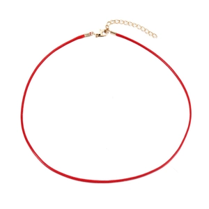 Detail of red wax cord necklace with golden lobster clasp and adjustable extension chain