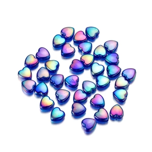 Macro shot of 9mm colorful acrylic heart beads with iridescent pearlescent finish for DIY