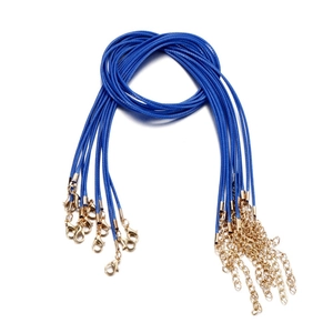 Detailed view of blue braided wax cords with gold lobster clasps and extension chains
