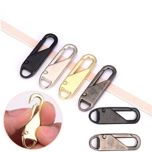 Close-up of alloy spring zipper pullers in black, silver, gold and bronze finishes
