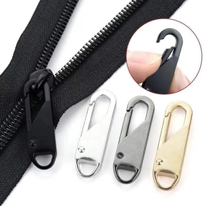 Macro detail of alloy zipper pulls showing spring hook mechanism and four color finishes