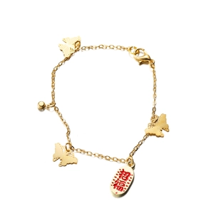 Golden butterfly charm bracelet with round bell and red招福pendant on white background