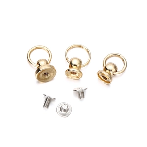 Detailed close-up of golden pull ring screw rivets for DIY handicraft and leather decor