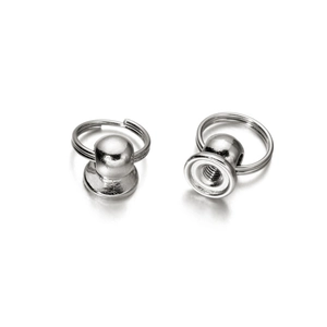 Detailed macro view of silver metal stud hardware with ring and internal thread design